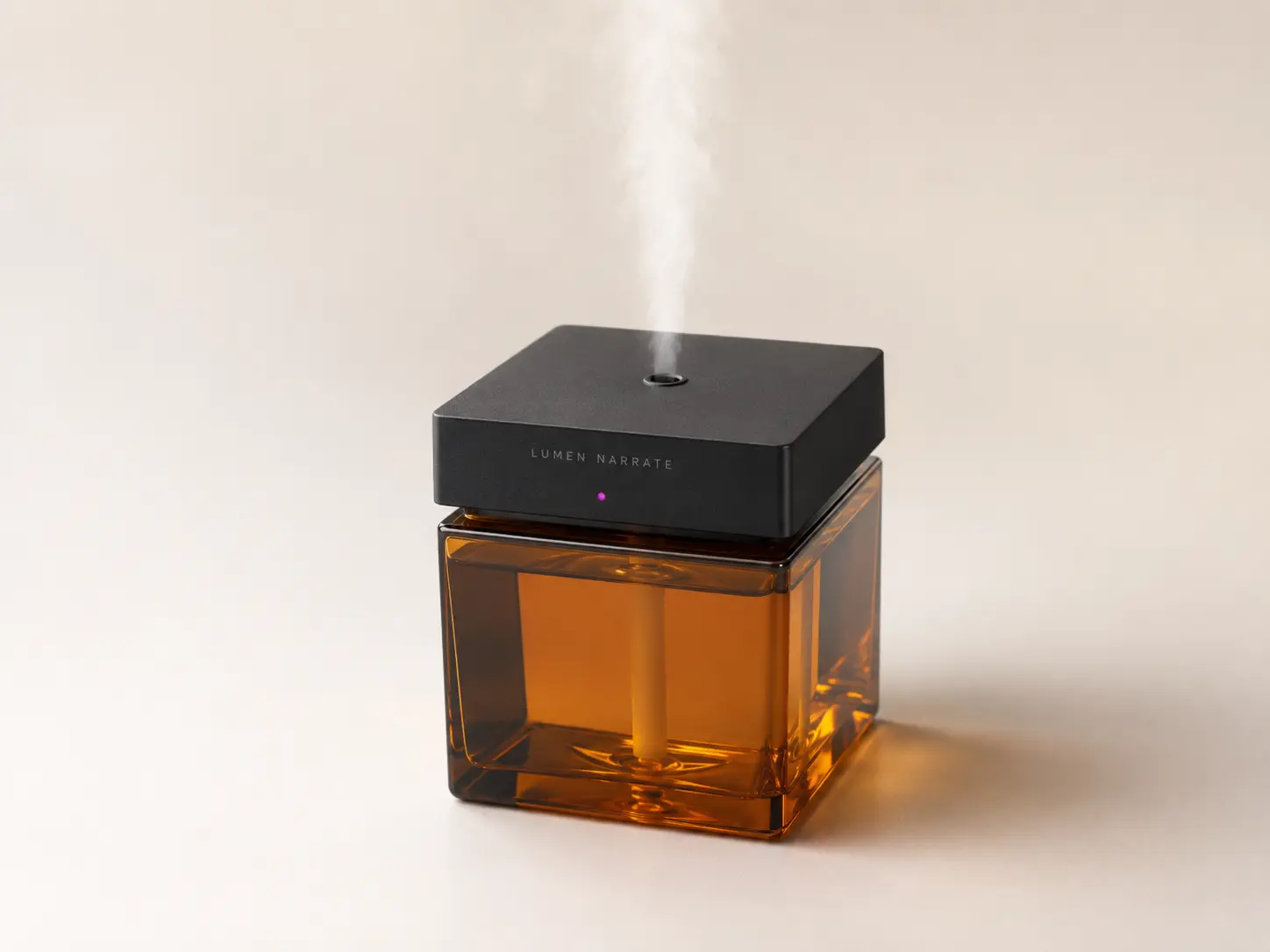 Lumen Narrate clap-controlled electronic fragrance sprayer with square amber reservoir and black electronic top