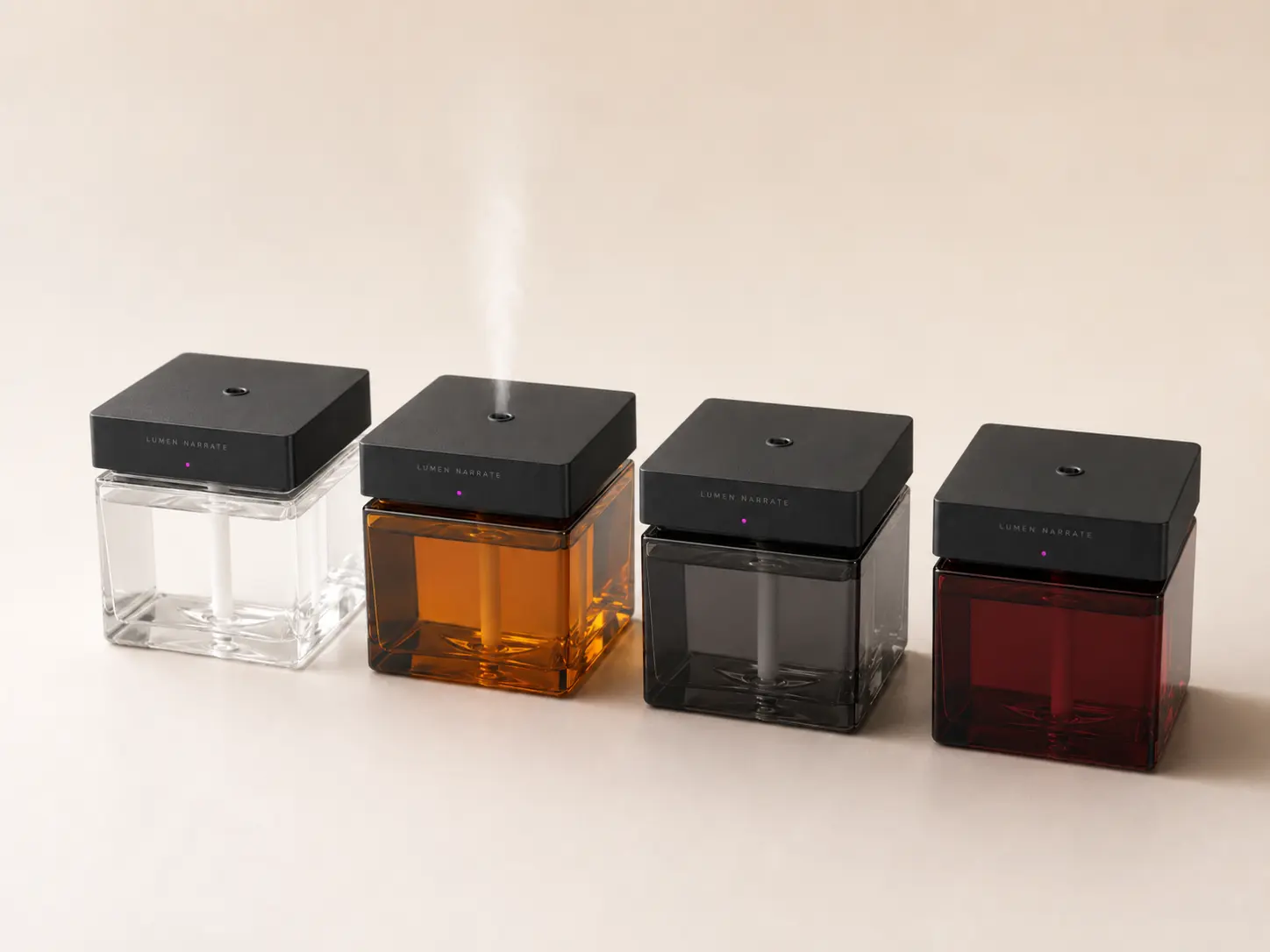Clap-controlled electronic fragrance sprayer visual color directions in clear, amber, smoke gray and burgundy