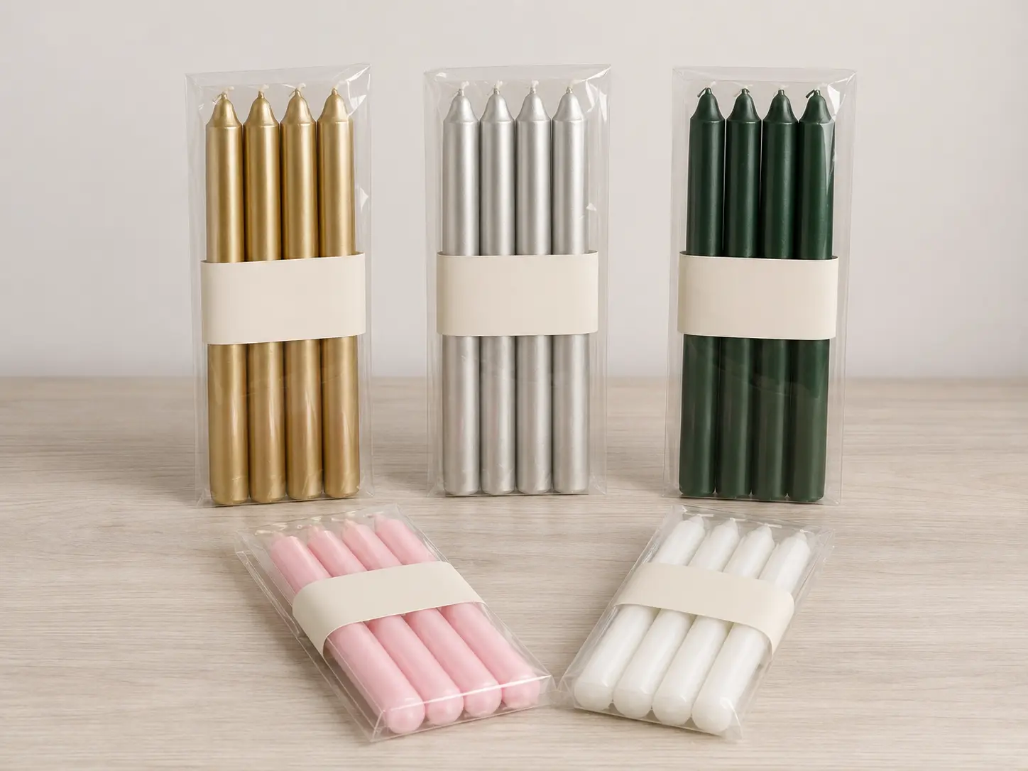 Four-piece taper candle packaging options with blank bands for private-label development