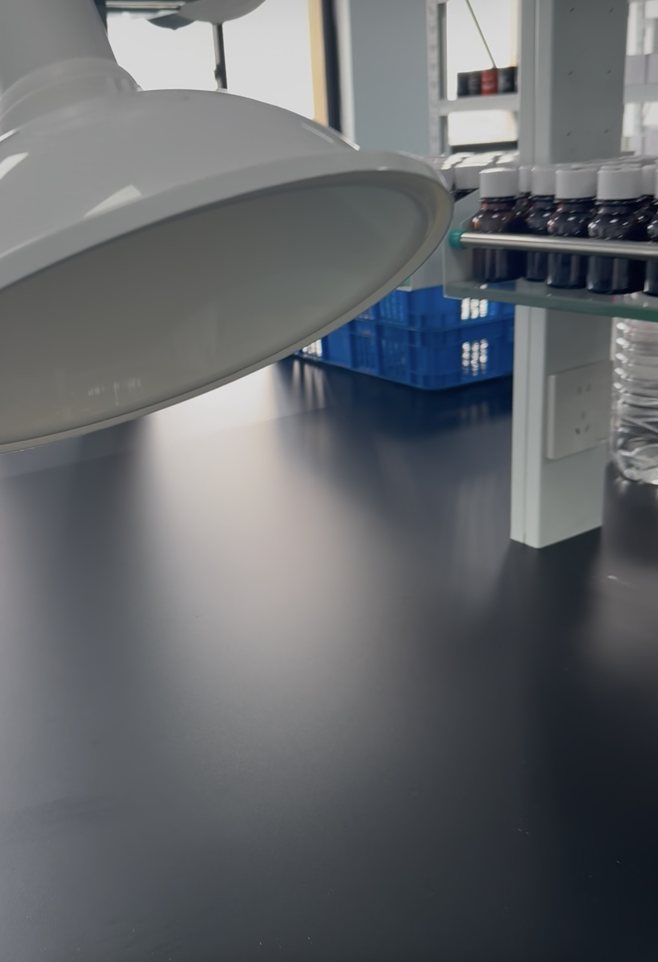 Fragrance sample workbench with a local extraction hood and sample bottles